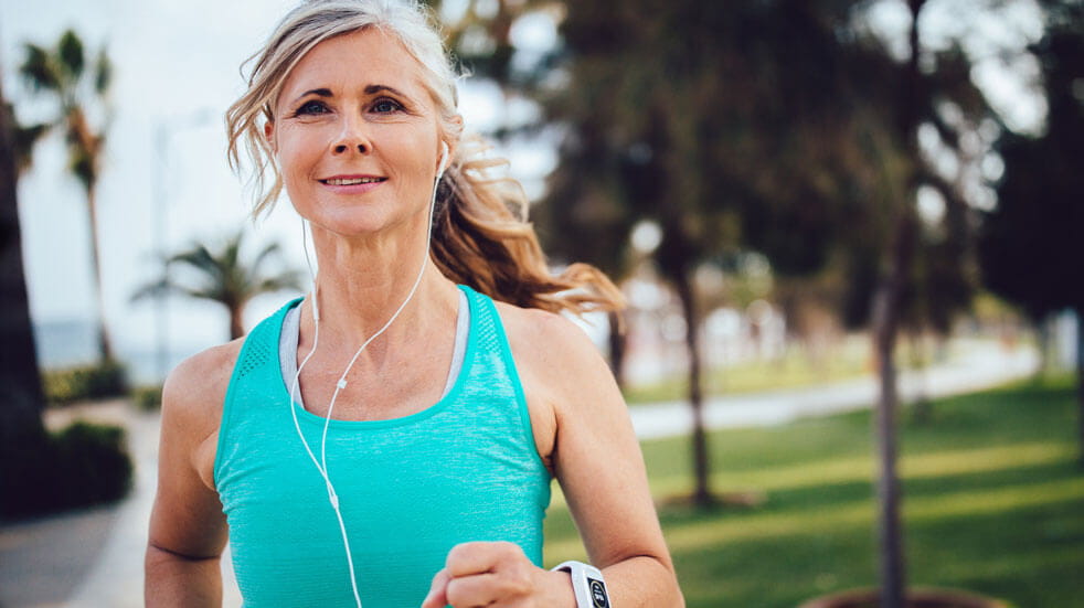 Everything you need to know about podcasts; woman running with headphones on